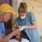 Dr. Felton working on a patient with a male assistant at the Honduras Dental Mission in 2011