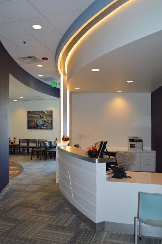 Receptionist desk from a right angle at {PRACTICE_NAME}