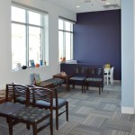 Patient waiting room from front door angle at {PRACTICE_NAME}