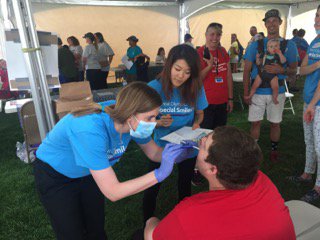Dr. Felton examining a patient at the Special Olympics Special Smiles event